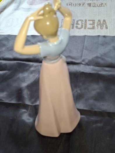 Getting Ready A Young Girl Fixing Her Hair from Nao Porcelain, Lladro, postage available or collection