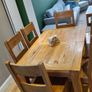 Solid wood oak extending dining table with matching chairs Image 6