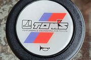 Genuine vintage TOM'S horn button for Toyota steering components.