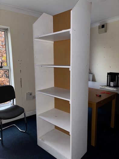 Tall white shelving unit