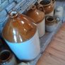 Collection of Eight Antique Stoneware Jars including Two Antique Hot Water Bottles Image 2