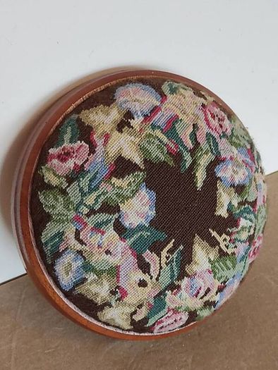 Vintage hand embroidered floral design on wooden base stool,