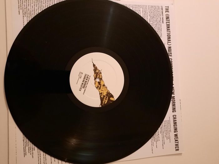 The International Noise Conspiracy: A New Morning Changing Weather LP (2001) (Fully autographed)