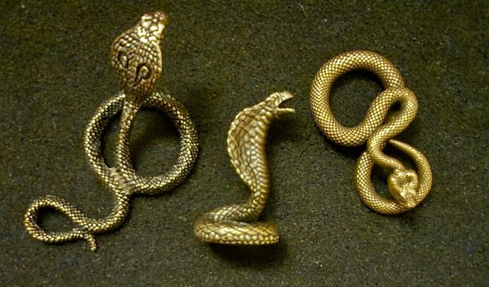 3 brass snakes.