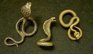 3 brass snakes.