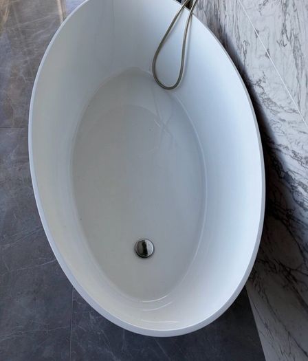 Freestanding stone bath