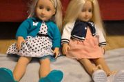 Two Our Generation dolls with outfits