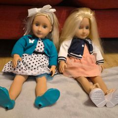 Two Our Generation dolls with outfits