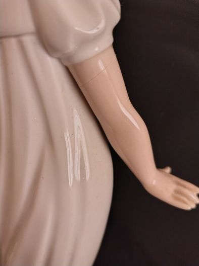 Nao by Lladro.  Yawning Girl. Damaged.