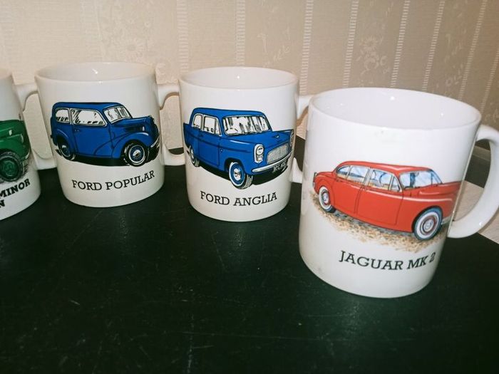 collection of six automotive mugs