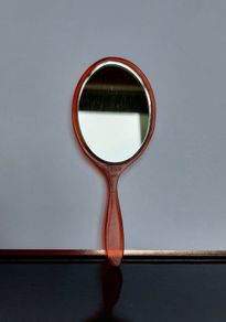 Vintage "Pygmalion" Hand Held Bakelite/Celluloid Bevelled Mirror