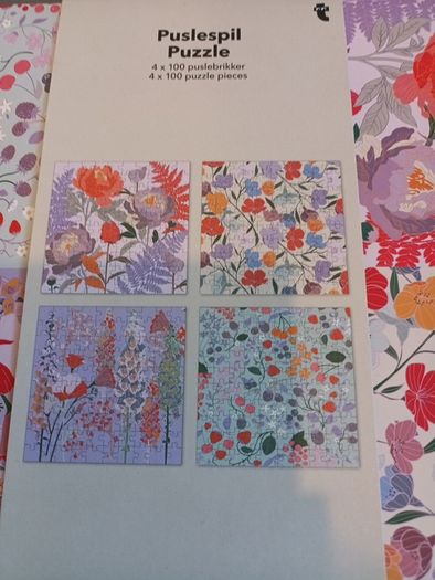 4 jigsaw puzzles on decorative box