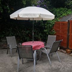Garden table, 4 chairs & parasol