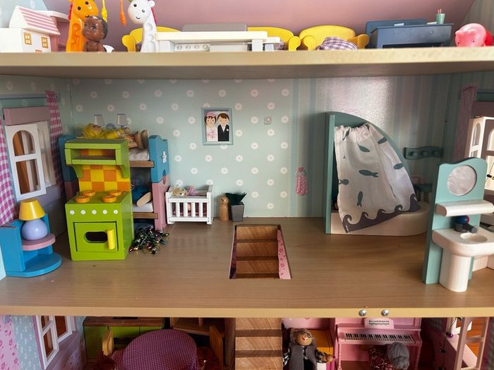Wooden dolls house with accessories
