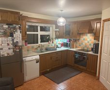 Wooden kitchen cabinets with dish washer and oven