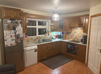 Wooden kitchen cabinets with dish washer and oven