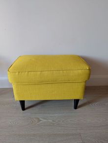 Yellow IKEA footstool strandmon
