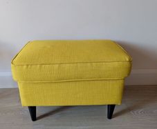 Yellow IKEA footstool strandmon