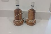 pair of handcarved wooden lamps