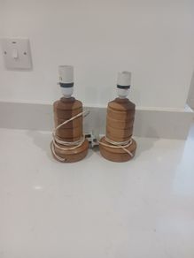 pair of handcarved wooden lamps