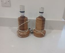 pair of handcarved wooden lamps