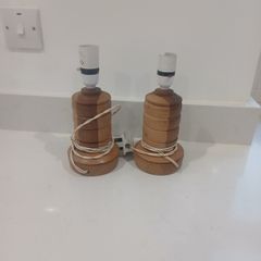 pair of handcarved wooden lamps
