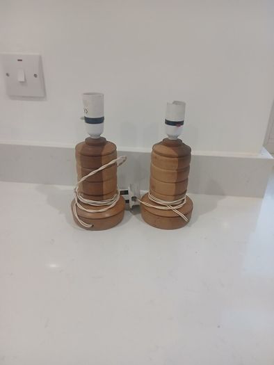 pair of handcarved wooden lamps