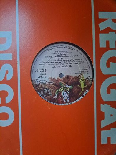 Genesis three sides live . Irish press on The famous Charisma label No sleeve . record 1 of a 2 record set