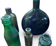 5 Vintage green glass bottles