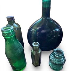 5 Vintage green glass bottles