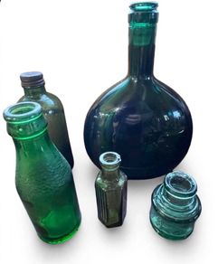 5 Vintage green glass bottles