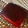 Leather Footstool on brass Castors. Image 5