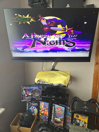 Sega Saturn w/ 3D Control Pad, Arcade Racer, Lightgun and Games