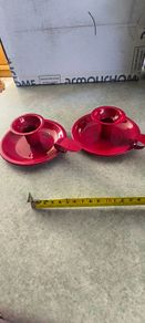 Set of 2  Red enamel candlestick holder and drip tray featuring a Considered by Helen James 12.00 euro each.