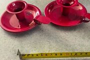 Set of 2  Red enamel candlestick holder and drip tray featuring a Considered by Helen James 12.00 euro each.