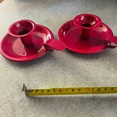 Set of 2  Red enamel candlestick holder and drip tray featuring a Considered by Helen James 12.00 euro each.