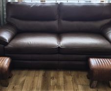 leather sofa plus footstools. 1 year old