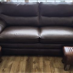 leather sofa plus footstools. 1 year old