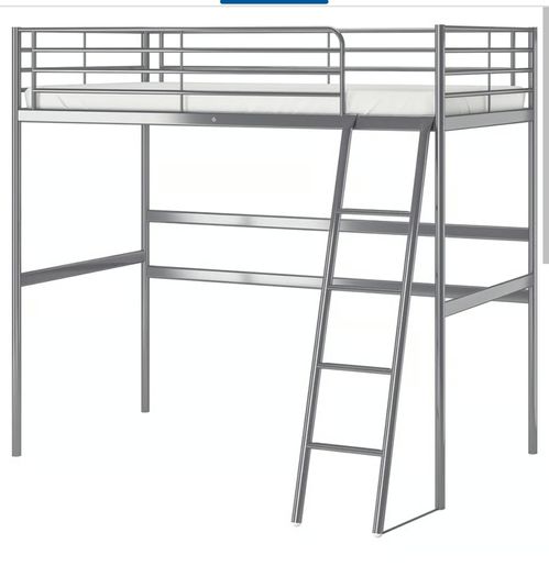 Metal framed loft bed with desk for sale.