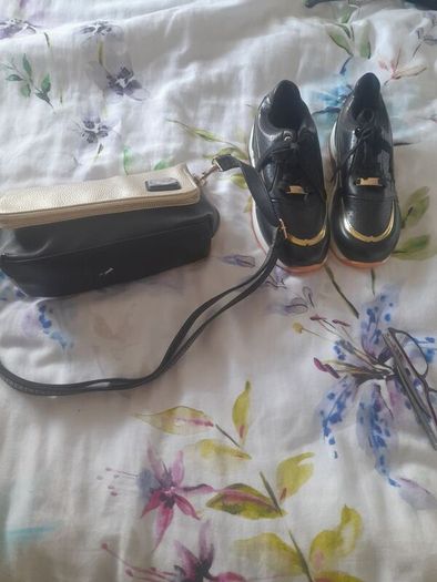 Selling  both together bag new with tags amd black and gold ladies trainers