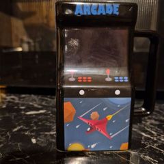 Retro Arcade Heat-Changing Mug, a novelty ceramic coffee mug shaped like a classic 1980s tabletop arcade cabinet