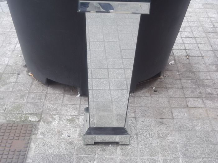 a shops display stand with mirror all round it