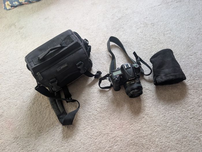 Nikon D7000 DSLR + Nikon 50mm f/1.8G + Tamron 18-200mm + Tripod + Camera Bag