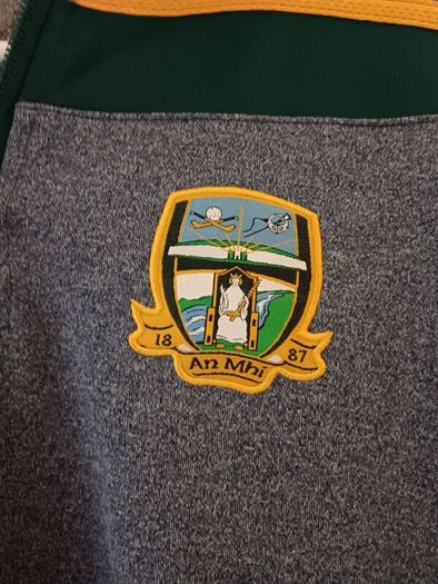 O'Neills Meath GAA Zip Top. Age 13. Width 47cm, Length 54cm. Very Good Condition. Price Includes Postage.
