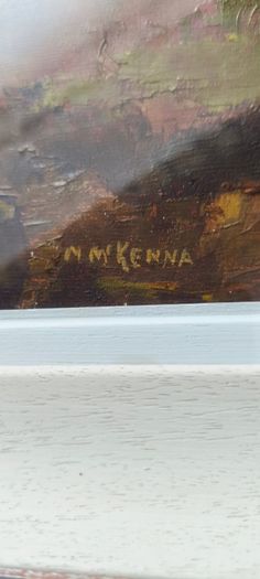 Framed under glass oil panting on board of land scape signed M.M KENNA