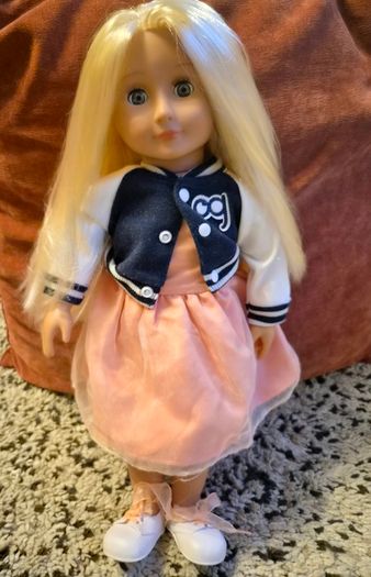 Two Our Generation dolls with outfits