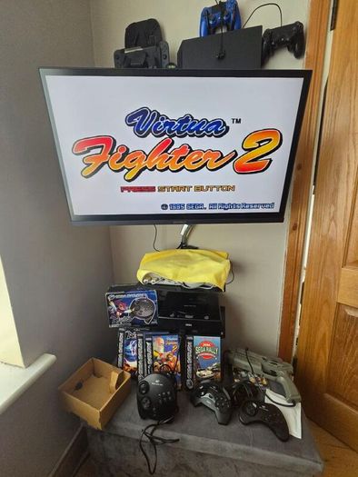 Sega Saturn w/ 3D Control Pad, Arcade Racer, Lightgun and Games