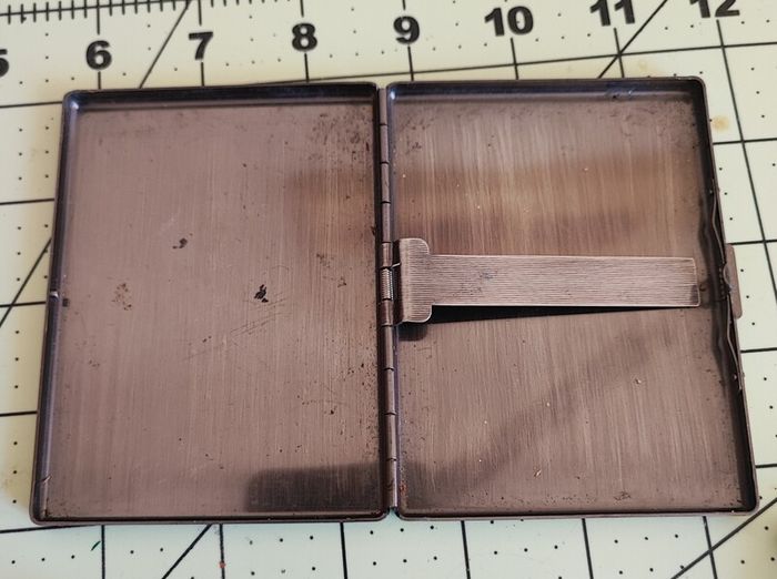 Old Zippos, Zippo flints, and a steel smokes case