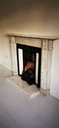 Regency Carrera Marble Bullseye Fireplace