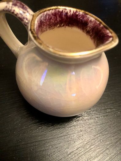 Old glazed creamer jug